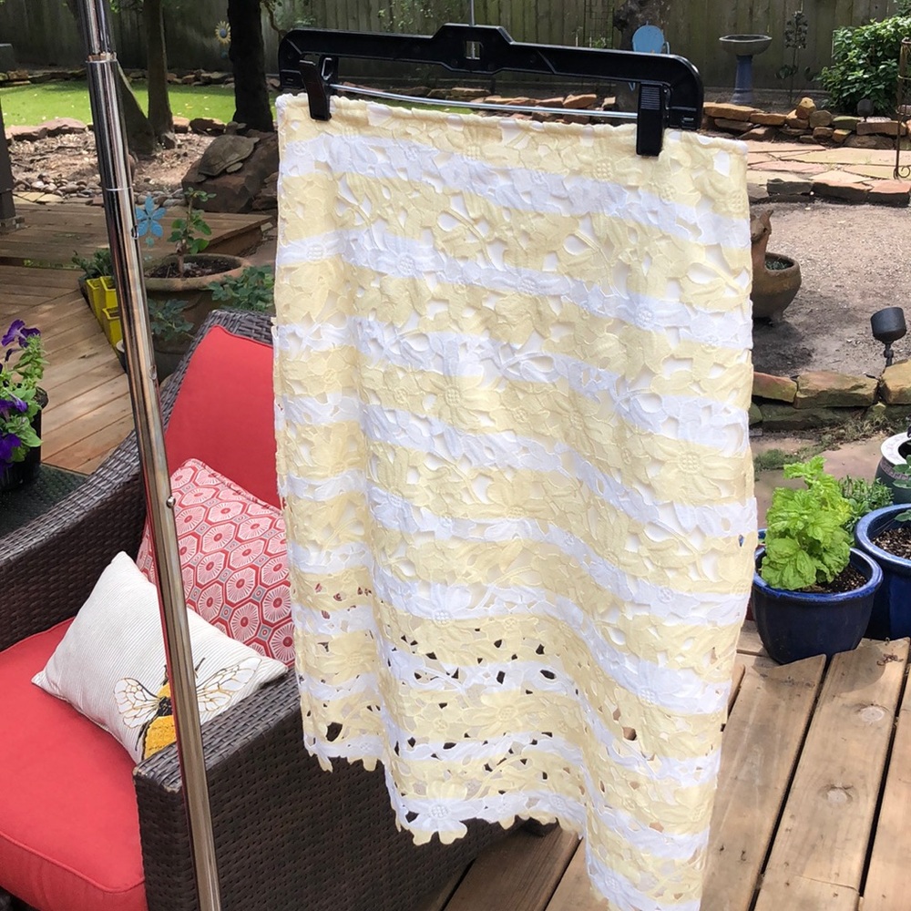 YELLOW & WHITE cut out skirt with stretchy lining.
